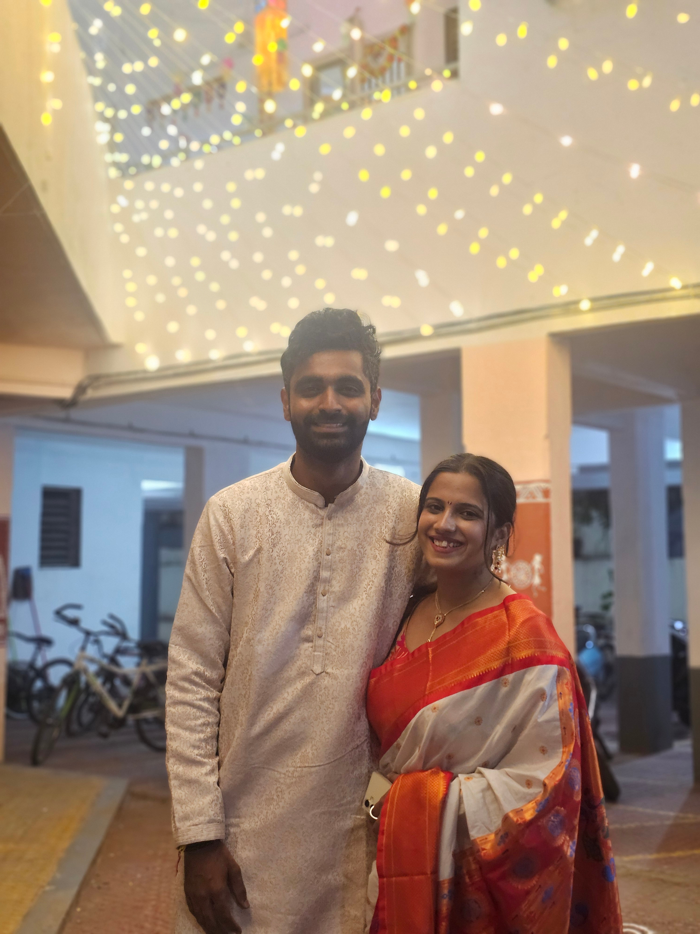 Nikita and Pranav under fairy lights